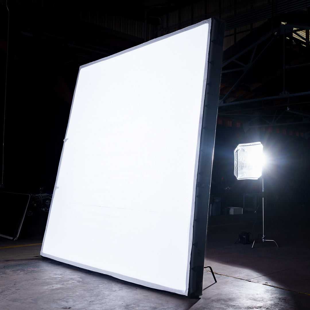 12x12 Butterfly Frame Photography Softbox illuminated in a studio setup, showcasing its large surface for soft light diffusion in professional shoots.