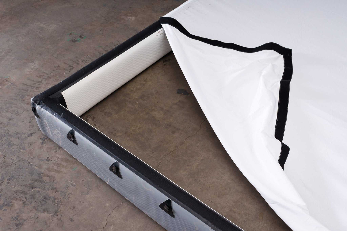 12x12 Butterfly Frame Photography Softbox with partially removed diffusion fabric, showing inflatable frame structure for soft light control.