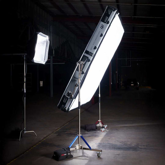 8x8 Butterfly Frame - Portable Frame Lighting setup in a dark warehouse, showcasing soft light diffusion for professional film production.