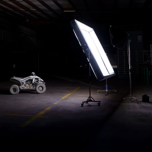8x8 Butterfly Frame - Portable Frame Lighting | Soft Light setup illuminating an ATV in a dark warehouse, ideal for cinematic soft lighting on set.